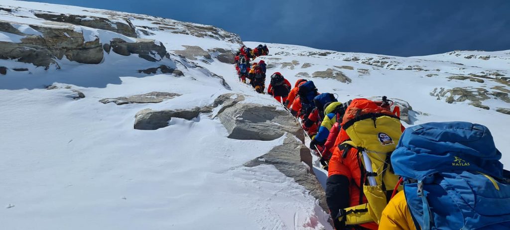 Line of climbers heading up