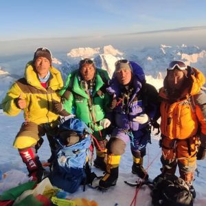 4 Sherpas on the sunny summit of Everest