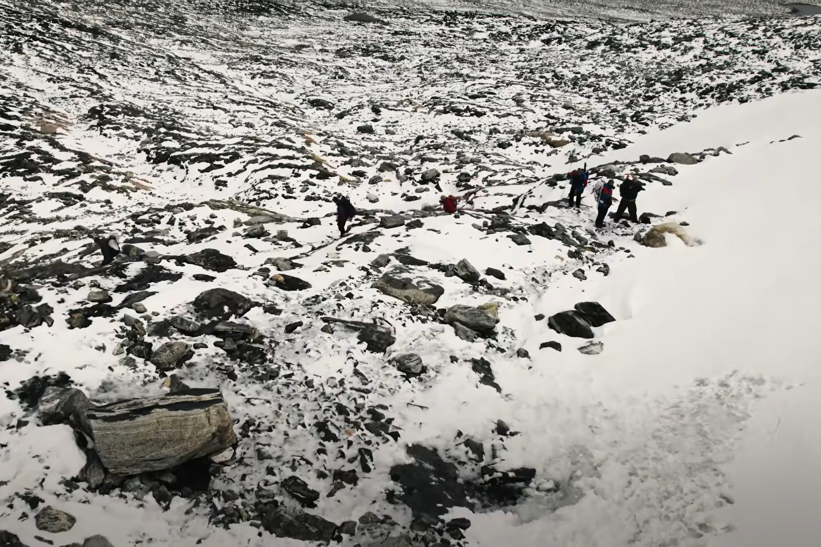 The team traverses the Digervarden ice patch on Sept. 26, 2021. Image: Glacier Archaeology Program / Secrets of the Ice