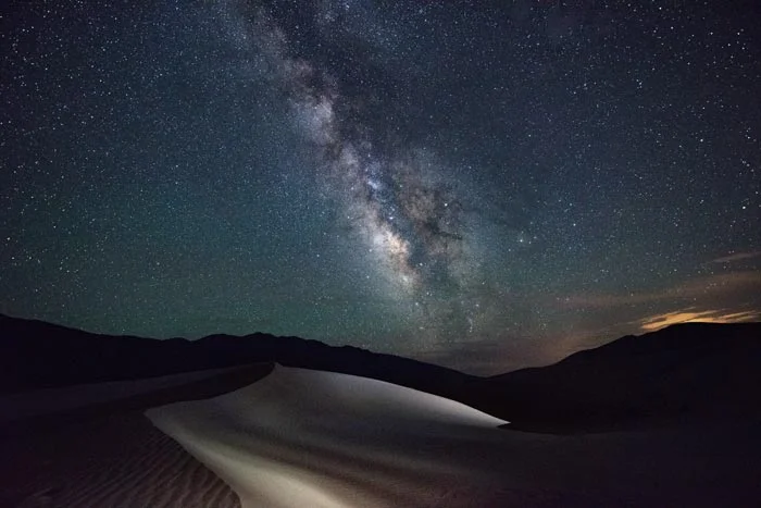 Light painting under the Milky Way in Great Sand Dunes National Park and Preserve - a dark sky location. 
