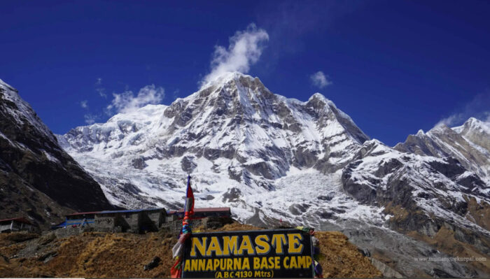 A board in front of Annapurna south face. 