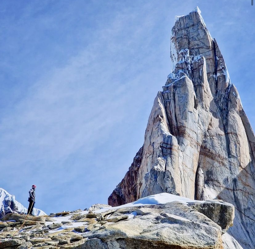 Giacomo Mauri staring at the full power of Cerro Torre from the summit of El Mocho. 