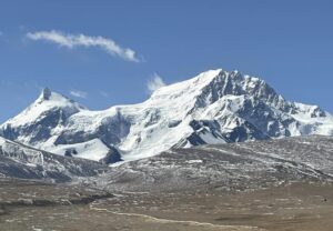 Shisha Pangma rising on a barren plain.
