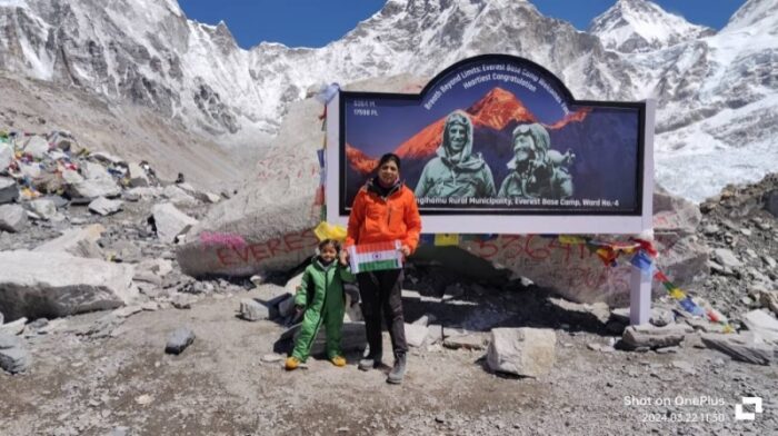 Young Gril and her mother in front of the Hillary-tenzing board at Everest Base Camp. 