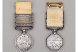 front and backside of a weathered medal