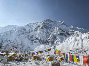 Annapurna Base camp, with some tents and a chorten in front og the impressive mountain.