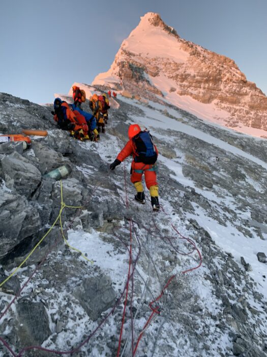 Climbers on the wind-sweot summit ridge of Everest north side. 