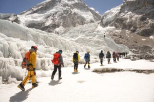 A line of climbers heading to the Khumbu Icefall on Everest