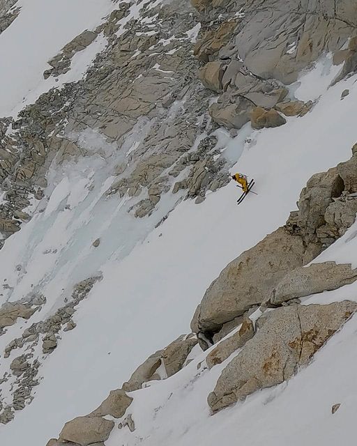 Ziemski skis down a snowy patch on an otherwise rocky, steep section of Makalu. 