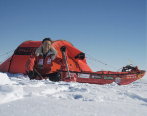 Abe beside his tent and sled in Antarctica.