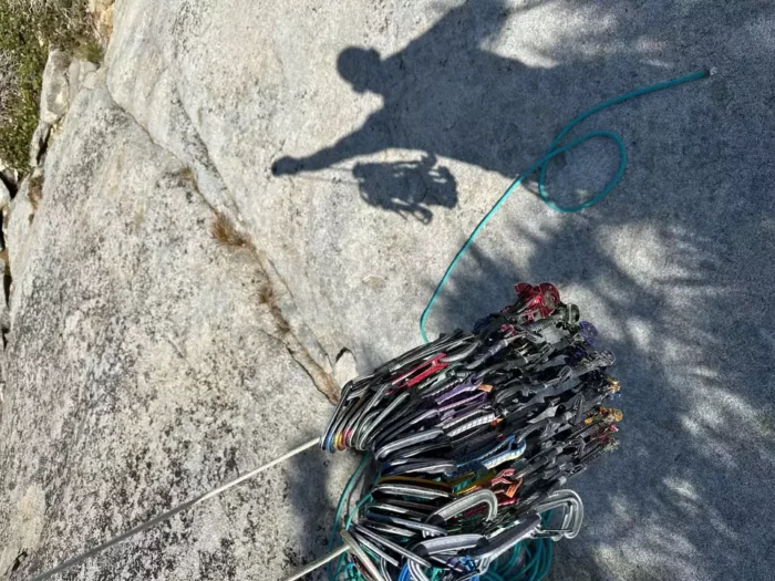 climber's rack of cams and carabiners