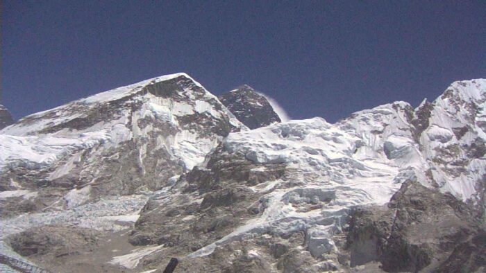 Everest in a sunny but windy Day, as shown by a wind plume on the summit ridge