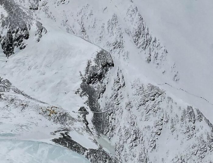 a drone image of the Lhotse flank, with the tiny points signaling climbers and porters on the route to Everest