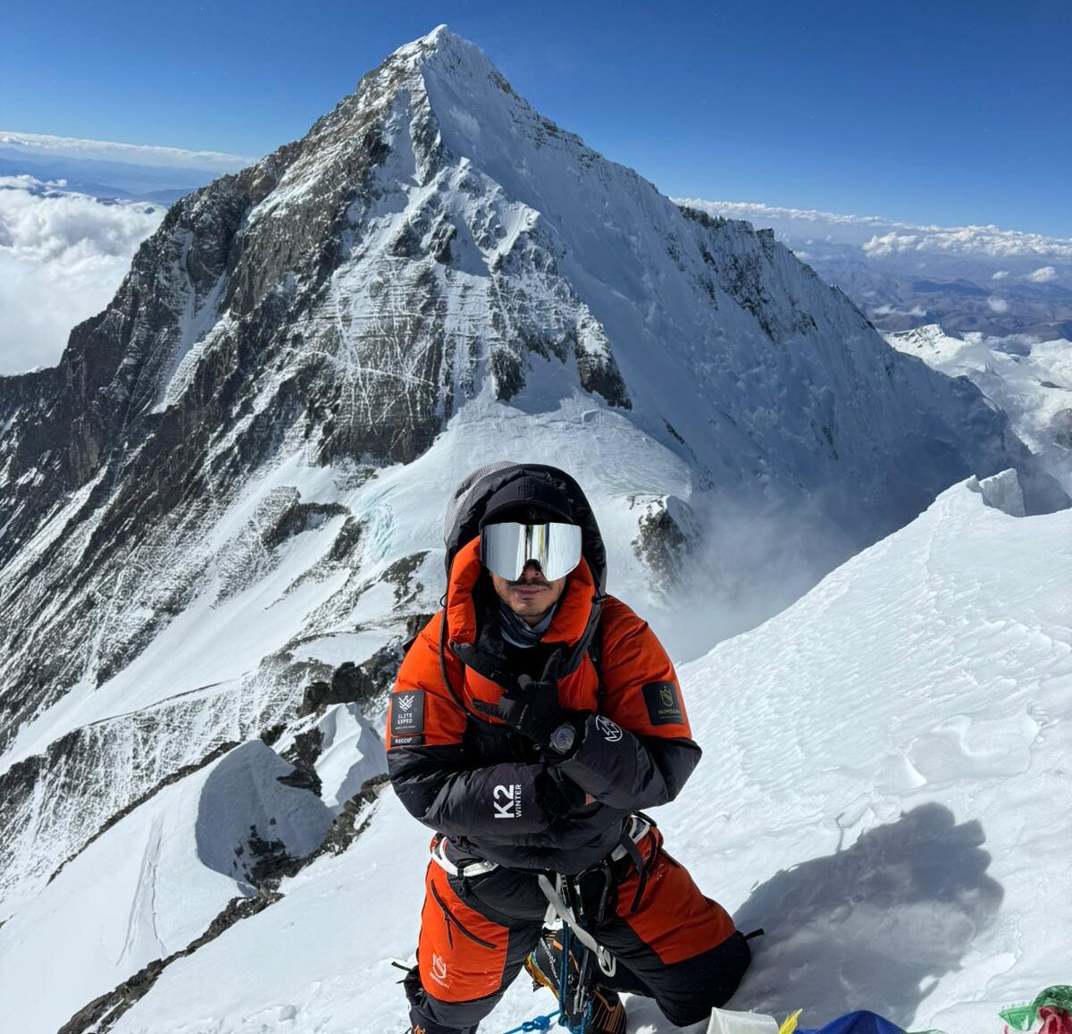 Nirmal Purja on the summit of Lhotse, Everest behind him