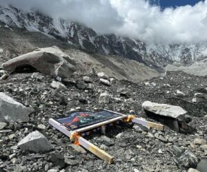 The board lying on the glacier rocky gound at an empty Everest Base Camp