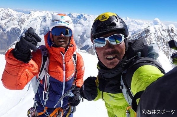 Japanese climbers greet from a summit.
