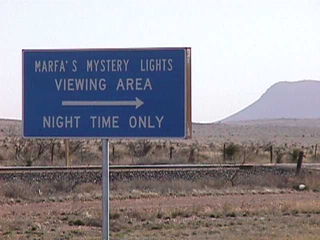 A road sign reading "Marfa's mystery lights viewing area, night time only"