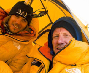 The Polish climber in yellow jackets and in a yellow tent.