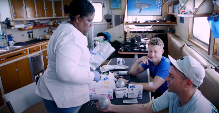 two men get their blood drawn