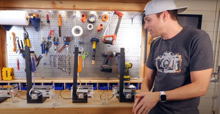 a man stands in front of a workbench