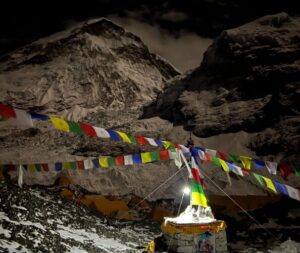 Everest at night from Base Camp, with a lamp on a chorten