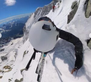 A skier photographed by his own headcam during a steep descent down Brenva face on Mont Blanc