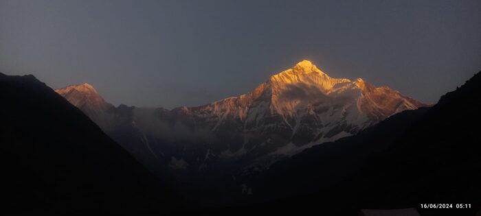 Nanda Devi peak shines with alpenglow at sunset