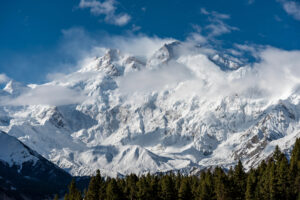 Nanga Parbat covered in snow and some clouds