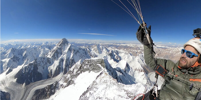 Antoine Girard flying above Broad Peak with K2 in background