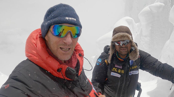 The climbers in bad weather among seracs, close shot. 