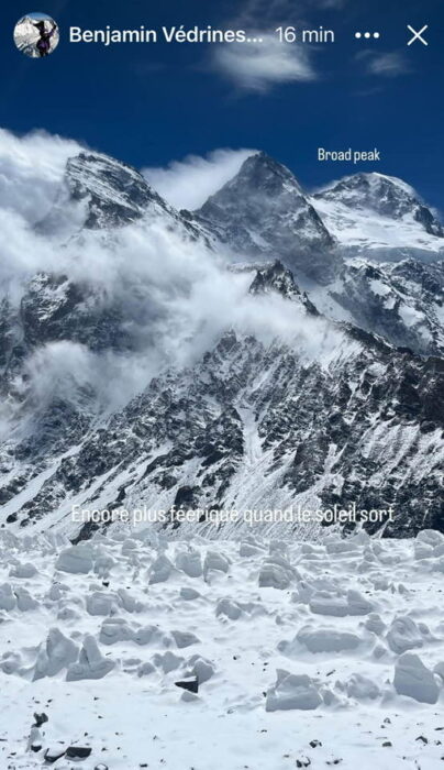 The summits of Broad Peaks rise among receding clouds.