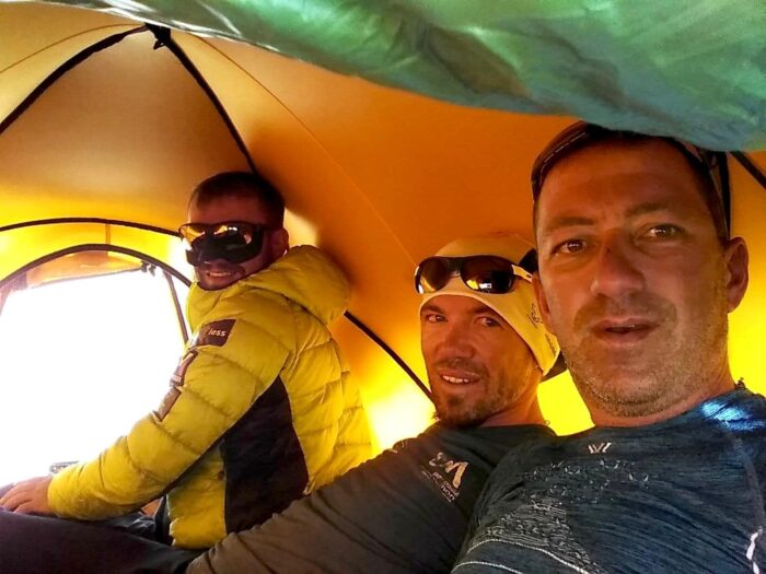 the climbers inside a tent