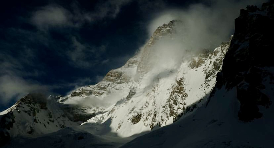 dark image of K2 with one piece in sunlight