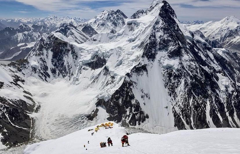 Climbers ascending towards the upper section of K2 via the normal route.