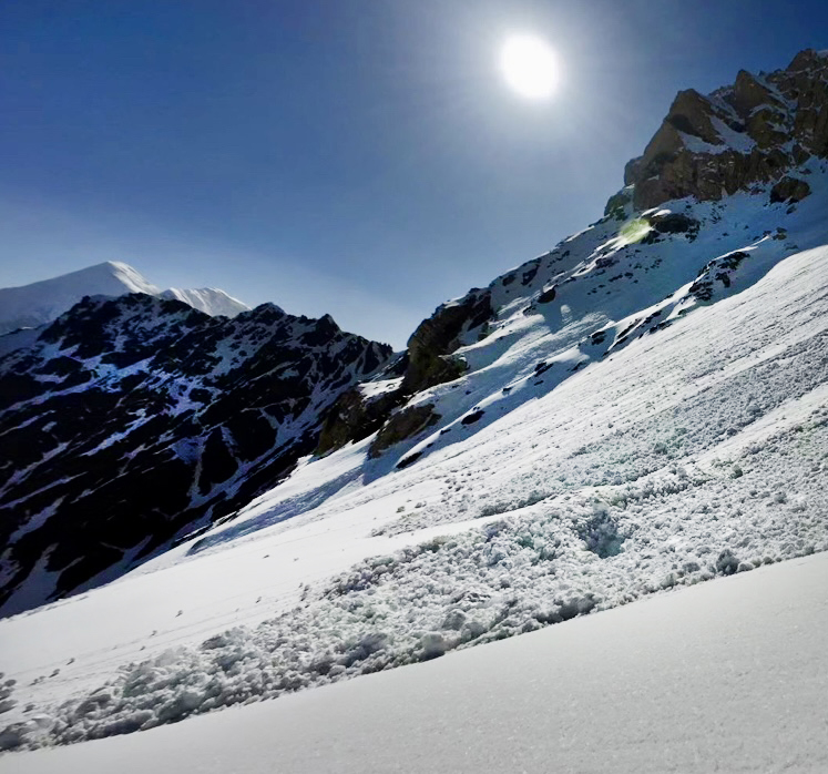 Avalanche remains on snowy slope