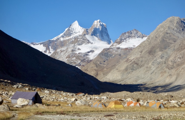 Base Camp in the Lalung Valley with Chiling I (left) and Chiling II. The steep, unclimbed north face of Chiling II (in shadow) faces right.