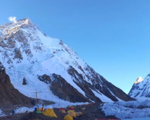 K2 at dawn with some BC tents at its base.