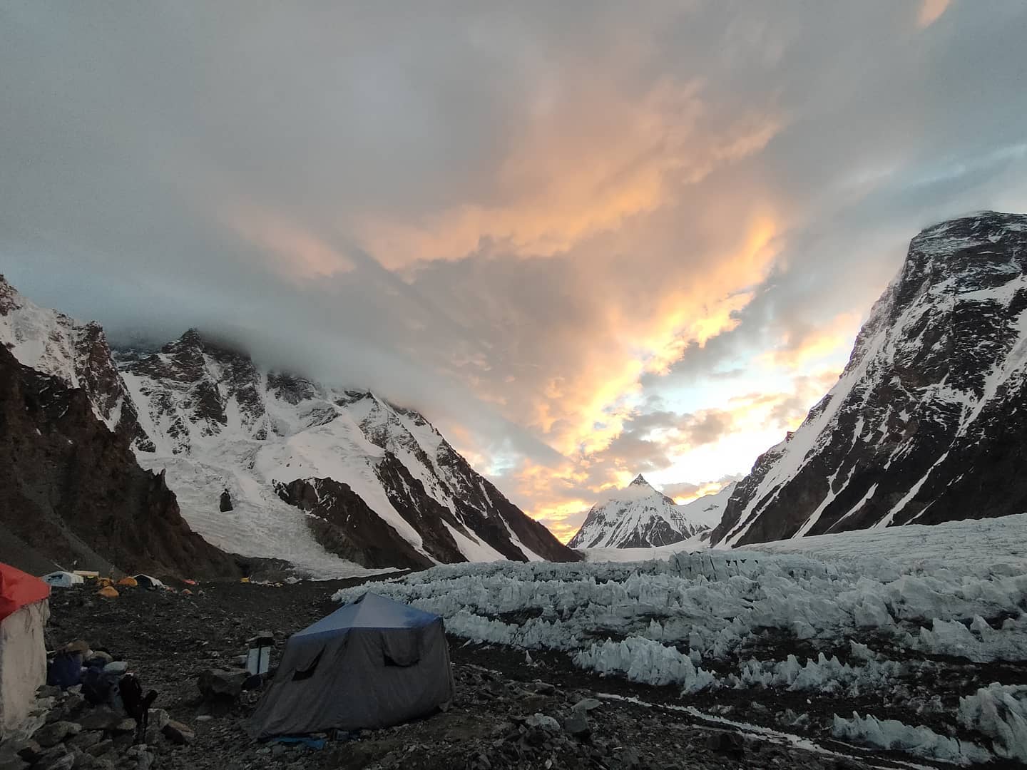 The lower part of K2 as seen from Base Camp, with clouds covering the ski and the mountain.