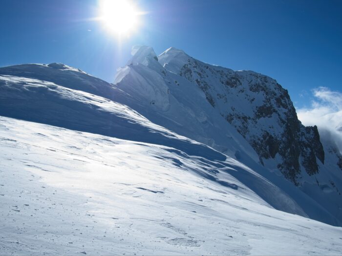 A snowy ridge and two summit pinnacles on Muchu Chhish