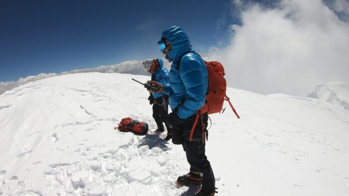 Climbers on a snow dome