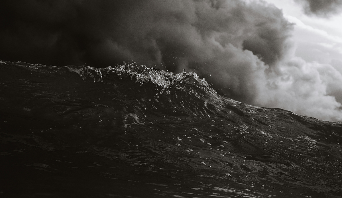 b/w photo of a dark ocean wave