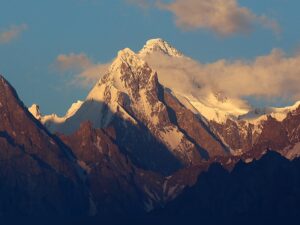 Trivor peak at sunset with some clouds on its flanks, seen from Hunza, Pakistan