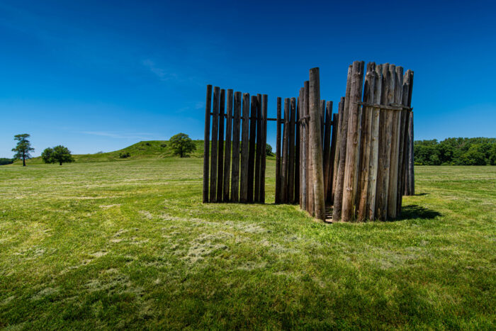 tall log fence-like structure