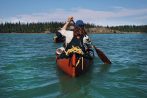 two canoes paddling away