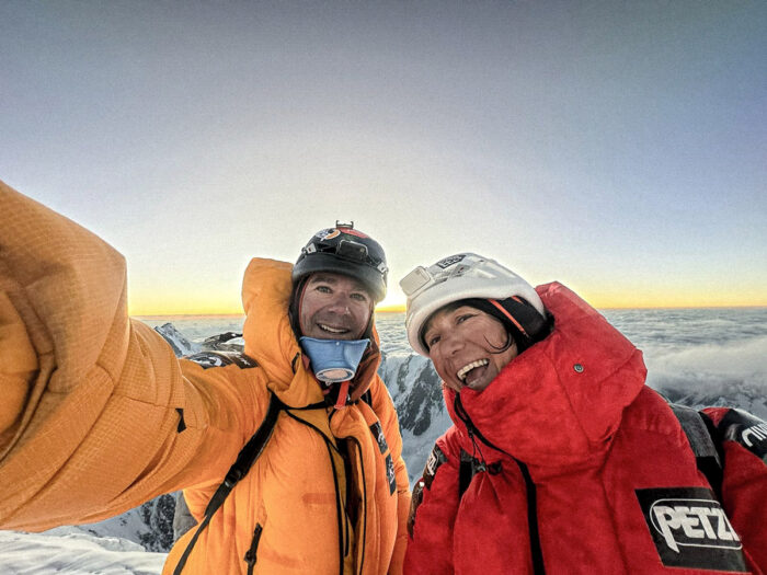 Close shot of the climbers on K2 summit in evening light