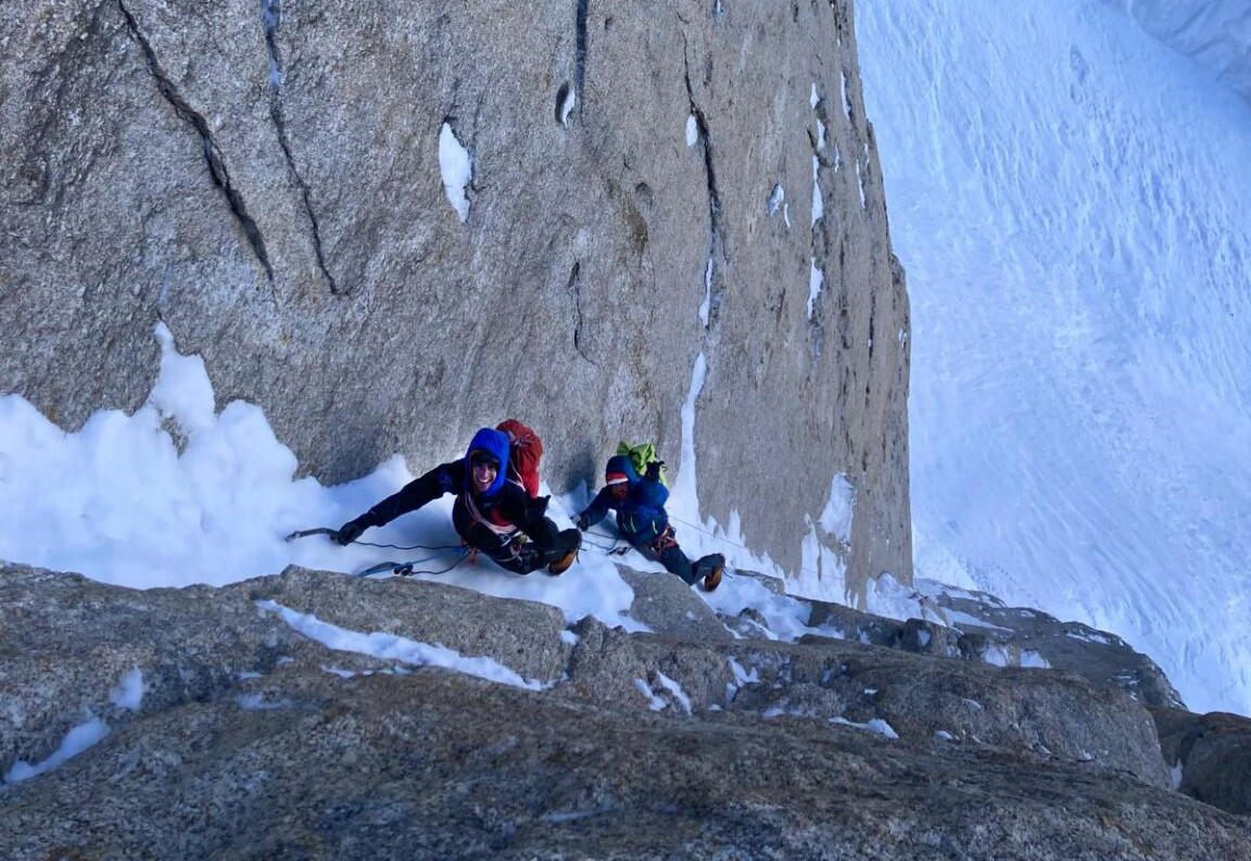 Climbers on a frozen up dihedral on Mount Hunter in Alaska