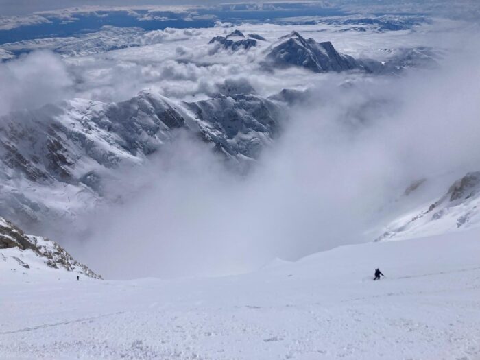 Huge snow ramps above the clouds on Denali Alaska