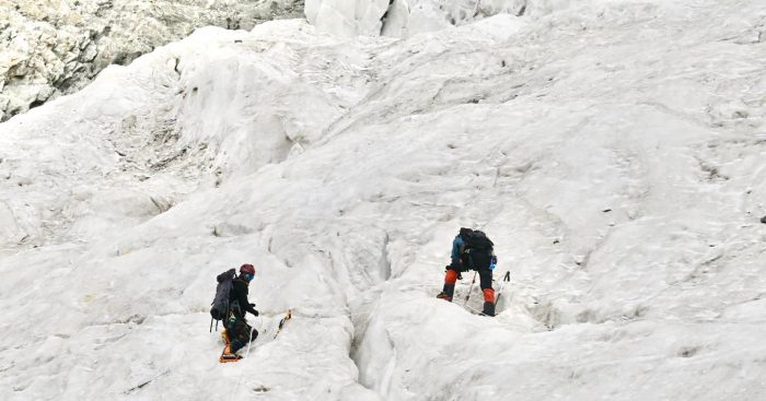 Climbers on a broken glaicer. 