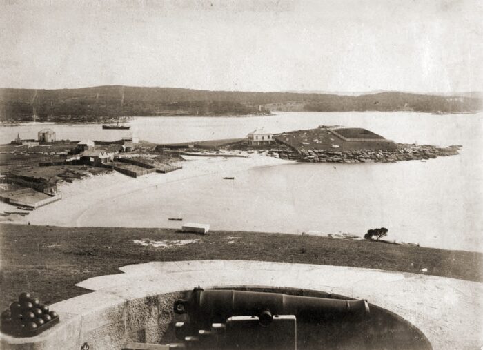 an archival photograph of a research station on a bay