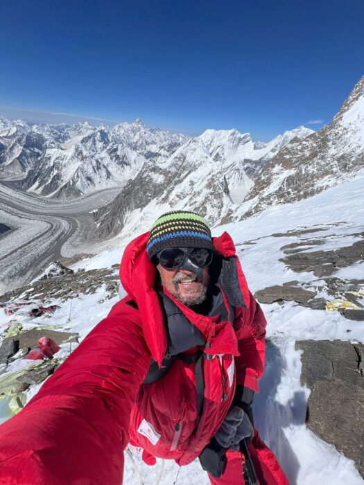 the climber takes a selfie at Camp 3 on K2 Cesen route